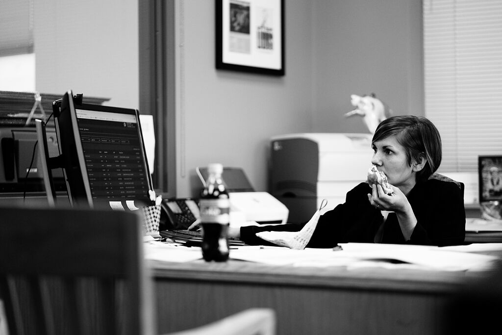 Boone County Clerk Brianna Lennon takes a minute to eat lunch while continuing her work